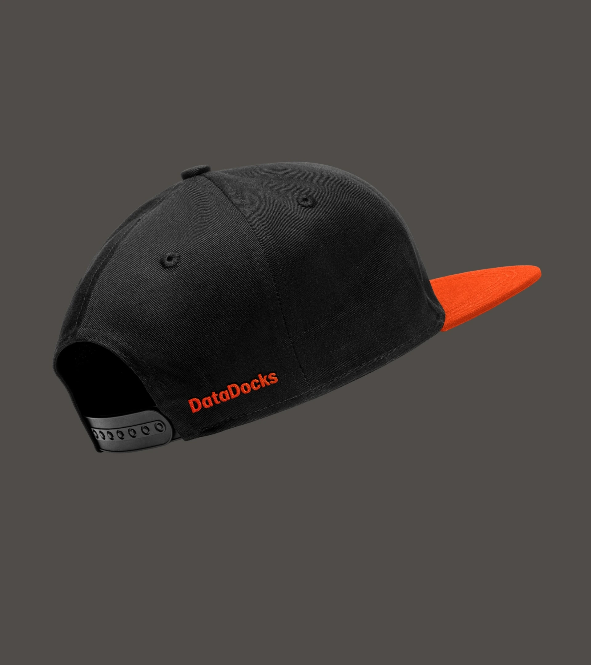 Black cap with an orange brim and embroidered DataDocks wordmark