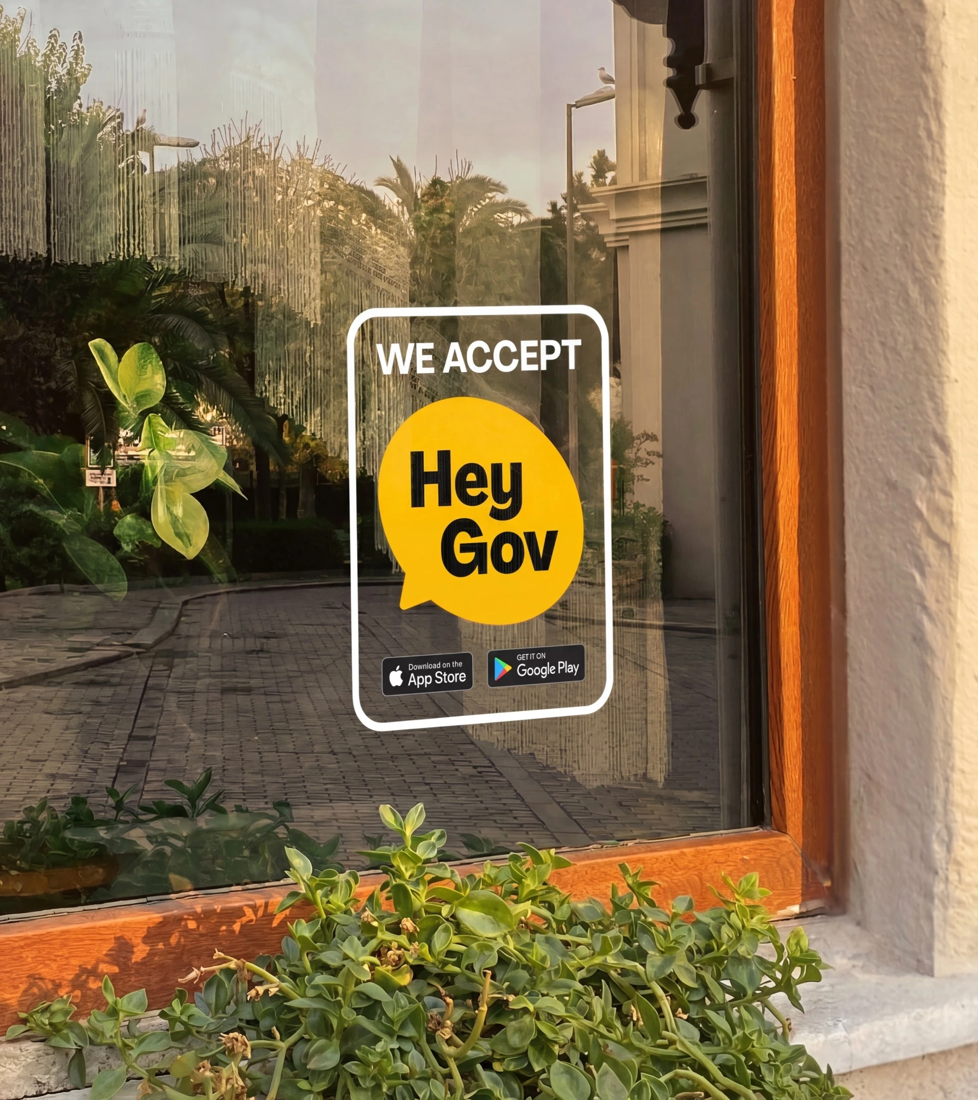 Storefront sticker showing that HeyGov payments are accepted
